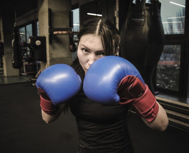 lisa-marie-theck-VpAp_3AKIIY-unsplash women posing with boxing gloves