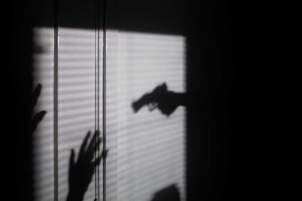 silhouette of a crime taking place