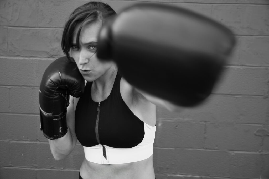 natalie-runnerstrom-TiVwpVnPuVk-unsplash women throwing a punch black and white