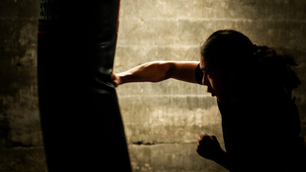 man punching a bag